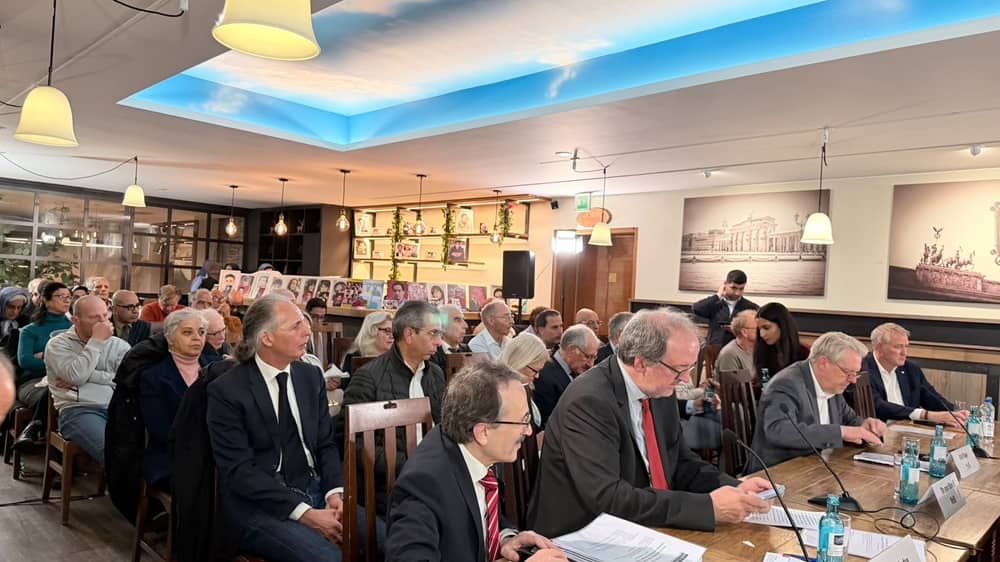 German lawmakers, former parliamentarians, diplomats, political analysts, and Iranian activists attend a conference on Iran’s political crisis in Berlin on October 14, 2026