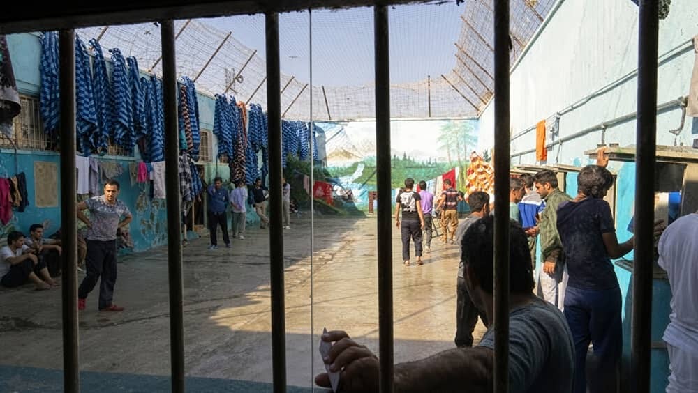 Prisoners in a courtyard at Qom Central Prison (Langarud Prison), Qom, Iran