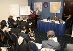 Paul Leventhal speaking to the meeting. Alireza Jafarzadeh and Prof. Raymond Tanter sitting in the panel