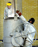 Two Iranians work at the zirconium production plant, part of the nuclear facilities in Isfahan in March 2005. Iran started a new round of converting uranium ore into the feedstock gas for making enriched uranium, a move likely to complicate diplomacy over Iran's disputed nuclear program, diplomats said.(AFP/File/Henghameh Fahimi) Two Iranians work at the zirconium production plant, part of the nuclear facilities in Isfahan in March 2005. Iran started a new round of converting uranium ore into the feedstock gas for making enriched uranium, a move likely to complicate diplomacy over Iran's disputed nuclear program, diplomats said.(AFP/File/Henghameh Fahimi)