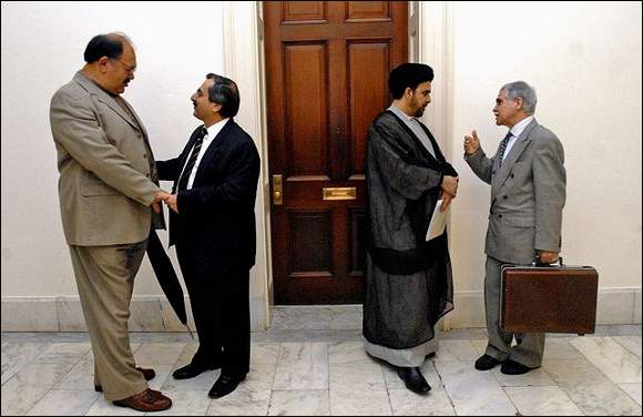 Alireza-Filabi-Lavai From left: Former Iranian wrestling champion Moslem Filabi, author Alireza Jafarzadeh, Shi'ite cleric Iyad Jamal al-Deen and Godarz M. Godarzi of the Defense for Rights of Iranian Minorities were on Capitol Hill yesterday to attend a policy briefing on Iran and Iraq.