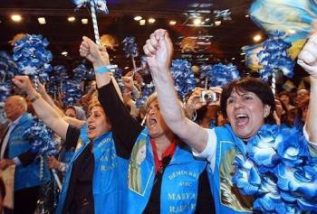 Iranian supporters gesture and wear jackets featuring Maryam Rajavi. More than 70,000 supporters of Iran's opposition protested near Paris on Saturday Iranian supporters gesture and wear jackets featuring Maryam Rajavi. More than 70,000 supporters of Iran's opposition protested near Paris on Saturday