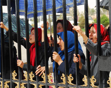  Camp Ashraf residents protest at the gate the forced entry of Iraqi Police into the Camp where some 3400 members of the main Iranian opposition group, the People&rsquo;s Mpjahedin Organization of Iran (PMOI) are living in exile.