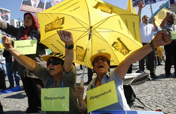 Exiled Iranians protest against Iraqi forces that took control of Camp Ashraf, north of Baghdad, in front of the Brandenburg Gate in Berlin, August 1, 2009. Iraq's government acknowledged on July 30 that seven Iranian exiles were killed when Iraqi forces took control of their camp this week north of Baghdad. Government spokesman Ali al-Dabbagh had earlier denied anyone died in the clashes between Iraqi forces and protesters who tried to block their entry into Camp Ashraf, home to the People's Mujahideen Organisation of Iran (PMOI) for two decades. The signs read "hunger strike". Simultaneous with hunger strike by Ashraf residents in intolerable summer heat in Iraq, hunger strikes by Iranian expatriates and supporters of the Iranian Resistance in solidarity with Ashraf residents across frExiled Iranians protest against Iraqi forces that took control of Camp Ashraf, north of Baghdad, in front of the Brandenburg Gate in Berlin, August 1, 2009. Iraq's government acknowledged on July 30 that seven Iranian exiles were killed when Iraqi forces took control of their camp this week north of Baghdad. Government spokesman Ali al-Dabbagh had earlier denied anyone died in the clashes between Iraqi forces and protesters who tried to block their entry into Camp Ashraf, home to the People's Mujahideen Organisation of Iran (PMOI) for two decades. The signs read "hunger strike".om the White House in Washington D.C. and the U.S. embassy in London entered their second week