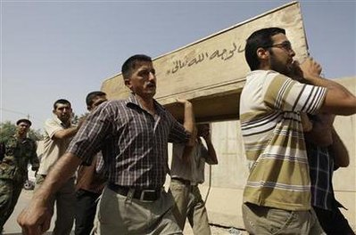 Residents carry the coffin of their relative who was killed in Baghdad's bombing on Wednesday outside a morgue in Baghdad, August 20, 2009 Residents carry the coffin of their relative who was killed in Baghdad's bombing on Wednesday outside a morgue in Baghdad, August 20, 2009