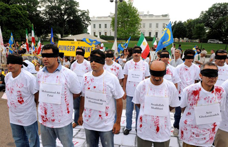 Demonstrators in black blindfolds and simulated bloody shirts with the names of Iranian exiles being detained by Iraq gather in front of the White House in Washington August 8, 2009. The rally was held in support of Iranian exiles in Camp Ashraf in Iraq who have been forcibly removed and detained by Iraqi forces, resulting in deaths and injuries. Demonstrators in black blindfolds and simulated bloody shirts with the names of Iranian exiles being detained by Iraq gather in front of the White House in Washington August 8, 2009. The rally was held in support of Iranian exiles in Camp Ashraf in Iraq who have been forcibly removed and detained by Iraqi forces, resulting in deaths and injuries.