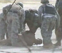 Iraqi forces abducting a Camp Ashraf resident Iraqi forces abducting a Camp Ashraf resident