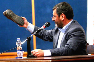 Safar Harandi holds shoe huled it him by students in Tehran University Safar Harandi holds shoe huled it him by students in Tehran University