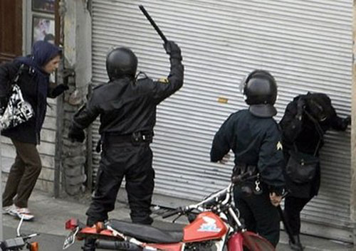 Iranian regime's State Security Forces on motorcycles surround anti-regime protesters during clashes in Tehran. Iranian regime's State Security Forces on motorcycles surround anti-regime protesters during clashes in Tehran.