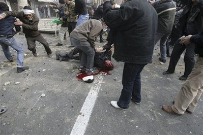 tehran-dec272009-2 The dead body of a man who allegedly was shot during anti-government protest at the Enqelab (Revolution) St. in Tehran, Iran, Sunday, Dec. 27, 2009