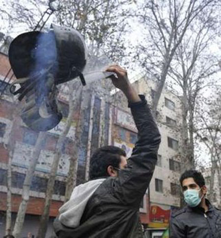 An Iranian protestor holds a helmet confiscated during clashes with police forces in central Tehran December 27, 2009. An Iranian protestor holds a helmet confiscated during clashes with police forces in central Tehran December 27, 2009.