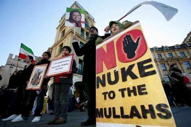 Iranian opposition members hold a sign which reads "No Nuke To The Mullahs" take past in a protest at the international security conference taking place on February 9, 2008 in Munich, southern Germany. Iranian opposition members hold a sign which reads "No Nuke To The Mullahs" take past in a protest at the international security conference taking place on February 9, 2008 in Munich, southern Germany.