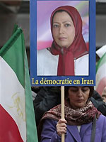 A woman holds a placard showing Maryam Rajavi, head of the Iranian opposition group National Council of Resistance, with writing on placard in French reading, "Democracy in Iran", during a demonstration outside the Italian Parliament, in Rome, Thursday, Feb. 11, 2010. A woman holds a placard showing Maryam Rajavi, head of the Iranian opposition group National Council of Resistance, with writing on placard in French reading, "Democracy in Iran", during a demonstration outside the Italian Parliament, in Rome, Thursday, Feb. 11, 2010.