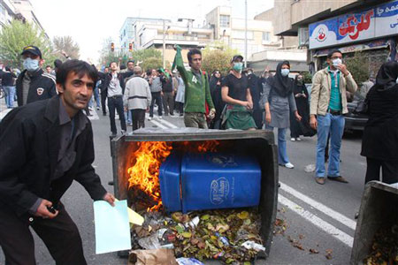 Rounding up garbage bins and old vehicles in Tehran to prevent them being set on fire by youths Rounding up garbage bins and old vehicles in Tehran to prevent them being set on fire by youths