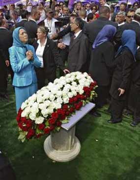 Maryam Rajavi waves the Iranian flag during a rally near Paris June 26 Maryam Rajavi waves the Iranian flag during a rally near Paris June 26