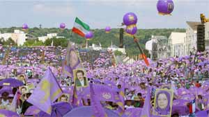 Maryam Rajavi waves the Iranian flag during a rally near Paris June 26 Maryam Rajavi waves the Iranian flag during a rally near Paris June 26