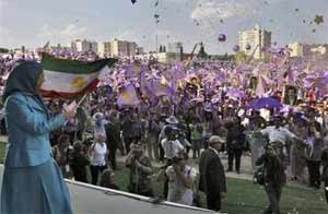 Maryam Rajavi waves the Iranian flag during a rally near Paris June 26 Maryam Rajavi waves the Iranian flag during a rally near Paris June 26