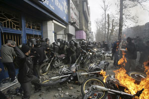 State Security Forces surrounded by angry protester in 2009
