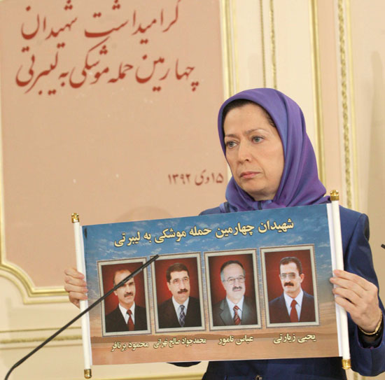 Maryam Rajavi, President-elect of the Iranian Resistance holds photos of four PMOI (MEK) members killed in December 26, 2014 missile attack on Camp Liberty, Iraq. Maryam Rajavi, President-elect of the Iranian Resistance holds photos of four PMOI (MEK) members killed in December 26, 2014 missile attack on Camp Liberty, Iraq.