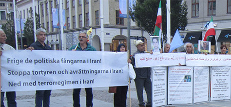 sweden4-500 Supporters of the PMOI (MEK) in Sweden condemn execution of Iranian Kurdish political prisoner Behrouz Alkhani in Iran. August 26, 2015